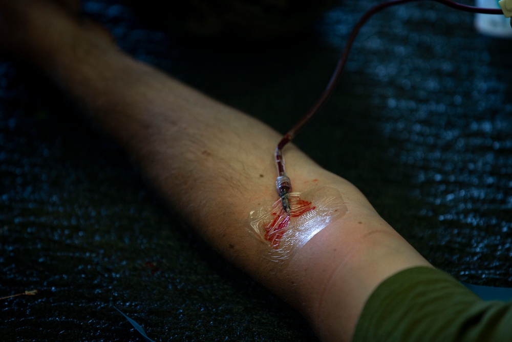 US Marines and Sailors conduct a live fresh old blood transfusion demonstration