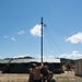 Sailors and Airmen assemble a ham radio HF antenna for Patriot 21