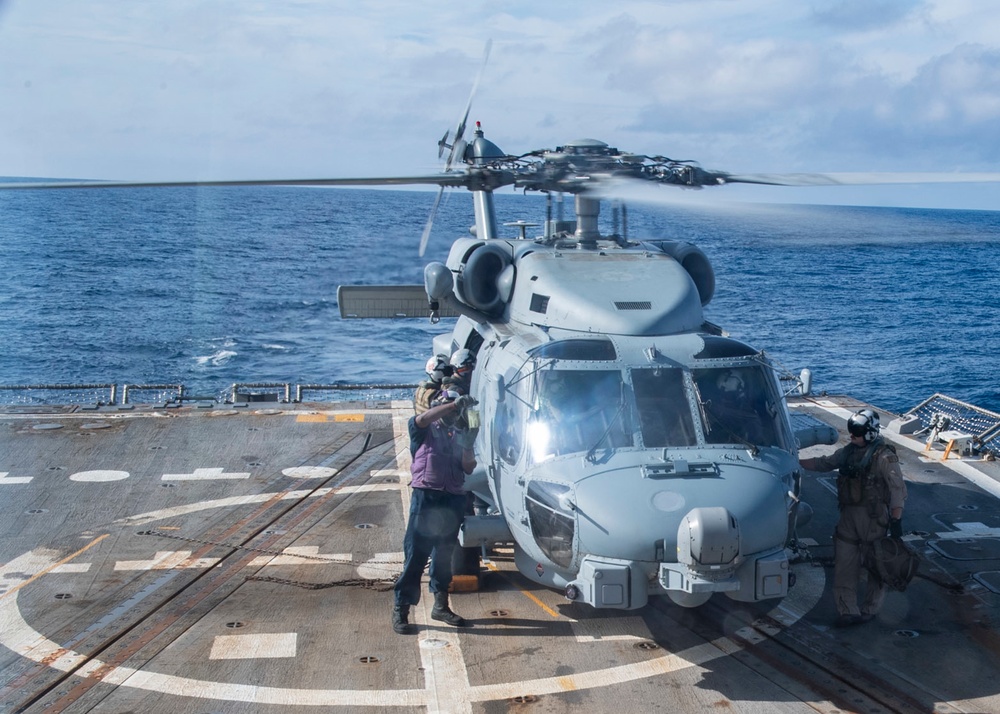 Sailor conducts a clear and bright test of JP-5 fuel from a MH-60R Seahawk assigned to the “Warlords” of Helicopter Maritime Strike Squadron (HSM-51)
