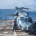 Sailor conducts a clear and bright test of JP-5 fuel from a MH-60R Seahawk assigned to the “Warlords” of Helicopter Maritime Strike Squadron (HSM-51)