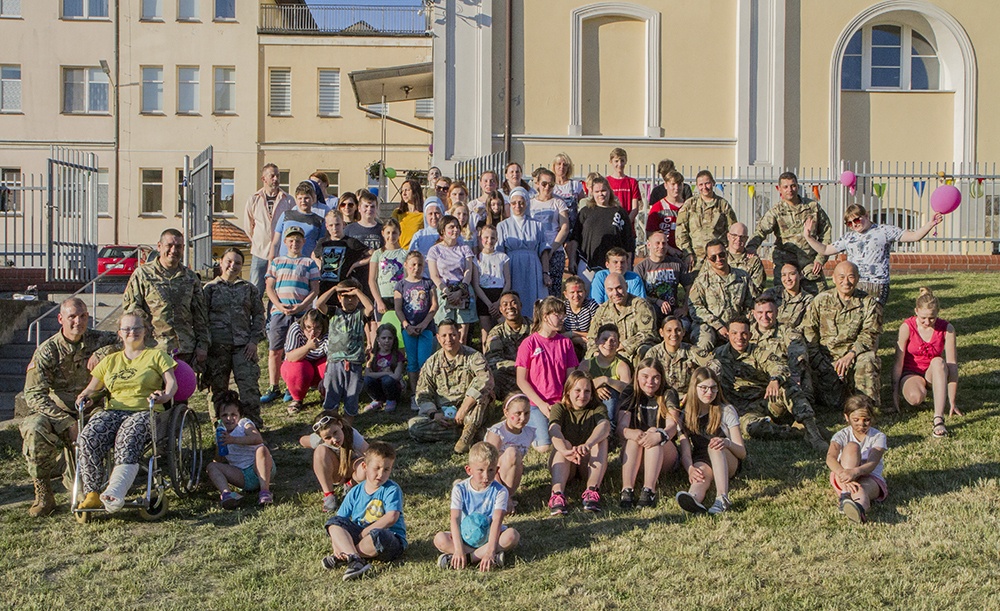 Deployed guardsmen visit local orphanage in Poland