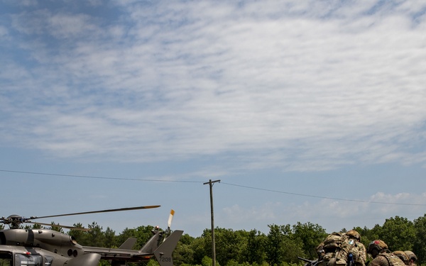Army and Air National Guardsmen simulate transporting casualties during PATRIOT 21