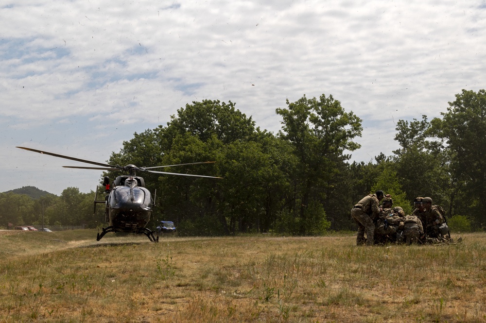 Army and Air National Guardsmen simulate transporting casualties during PATRIOT 21