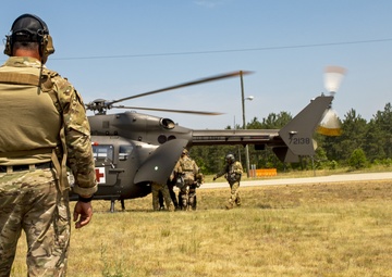 Army and Air National Guardsmen simulate transporting casualties during PATRIOT 21