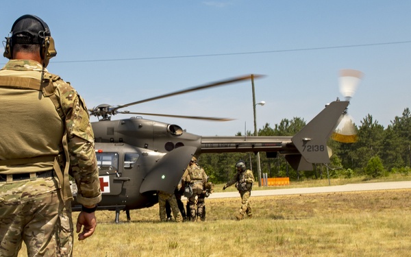 Army and Air National Guardsmen simulate transporting casualties during PATRIOT 21