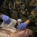 US Navy Sailors conduct a simulated mass casualty drill in response to a helicopter raid training exercise