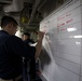 US Navy Sailors conduct a simulated mass casualty drill in response to a helicopter raid training exercise