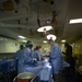 US Navy Sailors conduct a simulated mass casualty drill in response to a helicopter raid training exercise