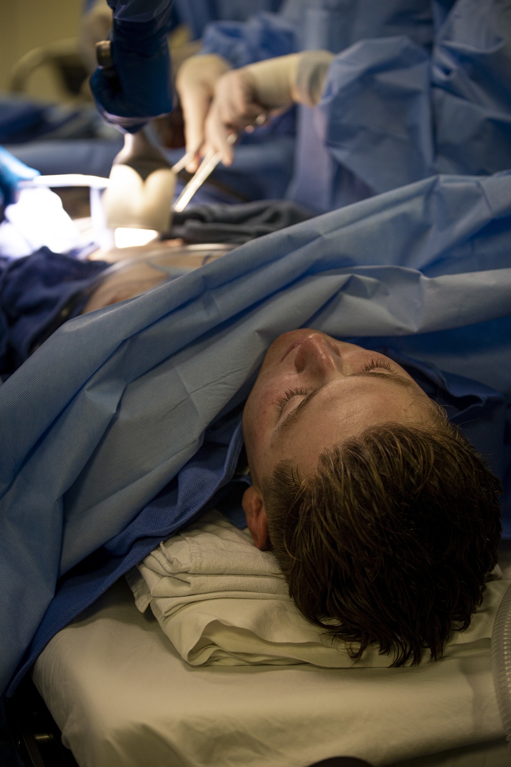 US Navy Sailors conduct a simulated mass casualty drill in response to a helicopter raid training exercise