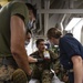 US Navy Sailors conduct a simulated mass casualty drill in response to a helicopter raid training exercise