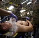 US Navy Sailors conduct a simulated mass casualty drill in response to a helicopter raid training exercise