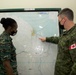 Canadian Armed Forces members providing operations planning process mentorship