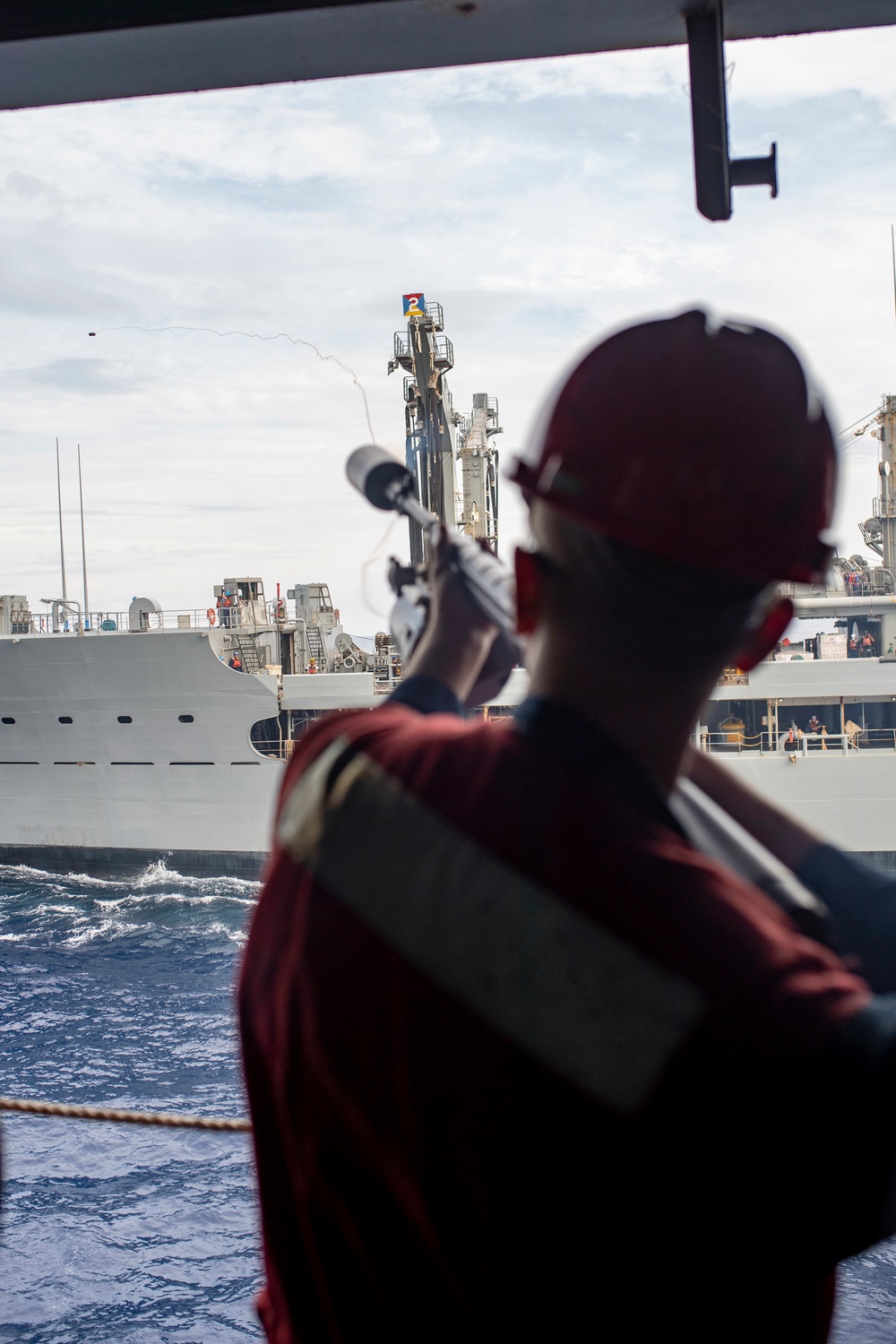 USS America conducts a replenishment-at-sea with the fleet replenishment oiler USNS Rappahannock