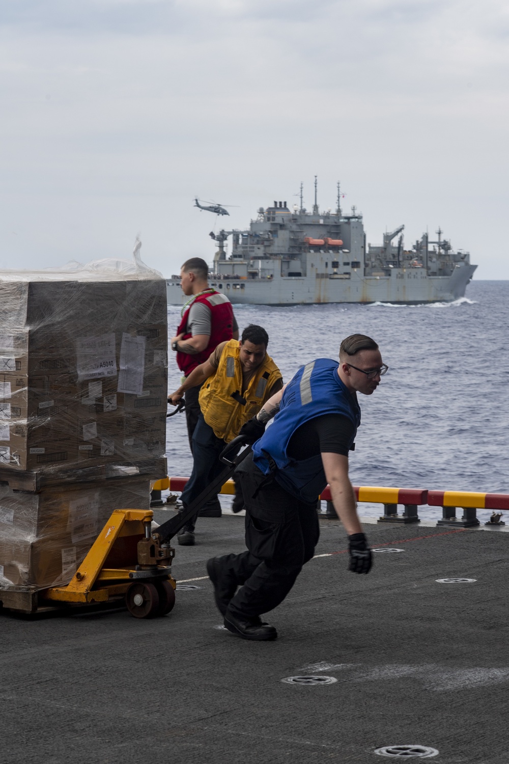 USS America conducts a replenishment-at-sea with the fleet replenishment oiler USNS Rappahannock