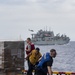 USS America conducts a replenishment-at-sea with the fleet replenishment oiler USNS Rappahannock