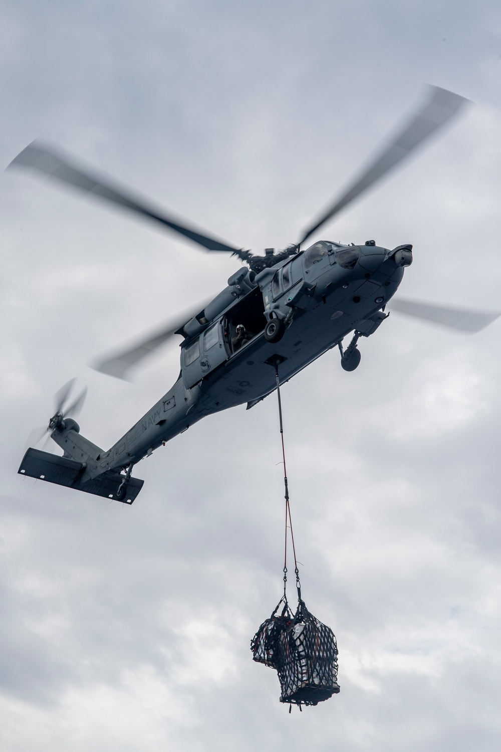 USS America conducts a replenishment-at-sea with the fleet replenishment oiler USNS Rappahannock