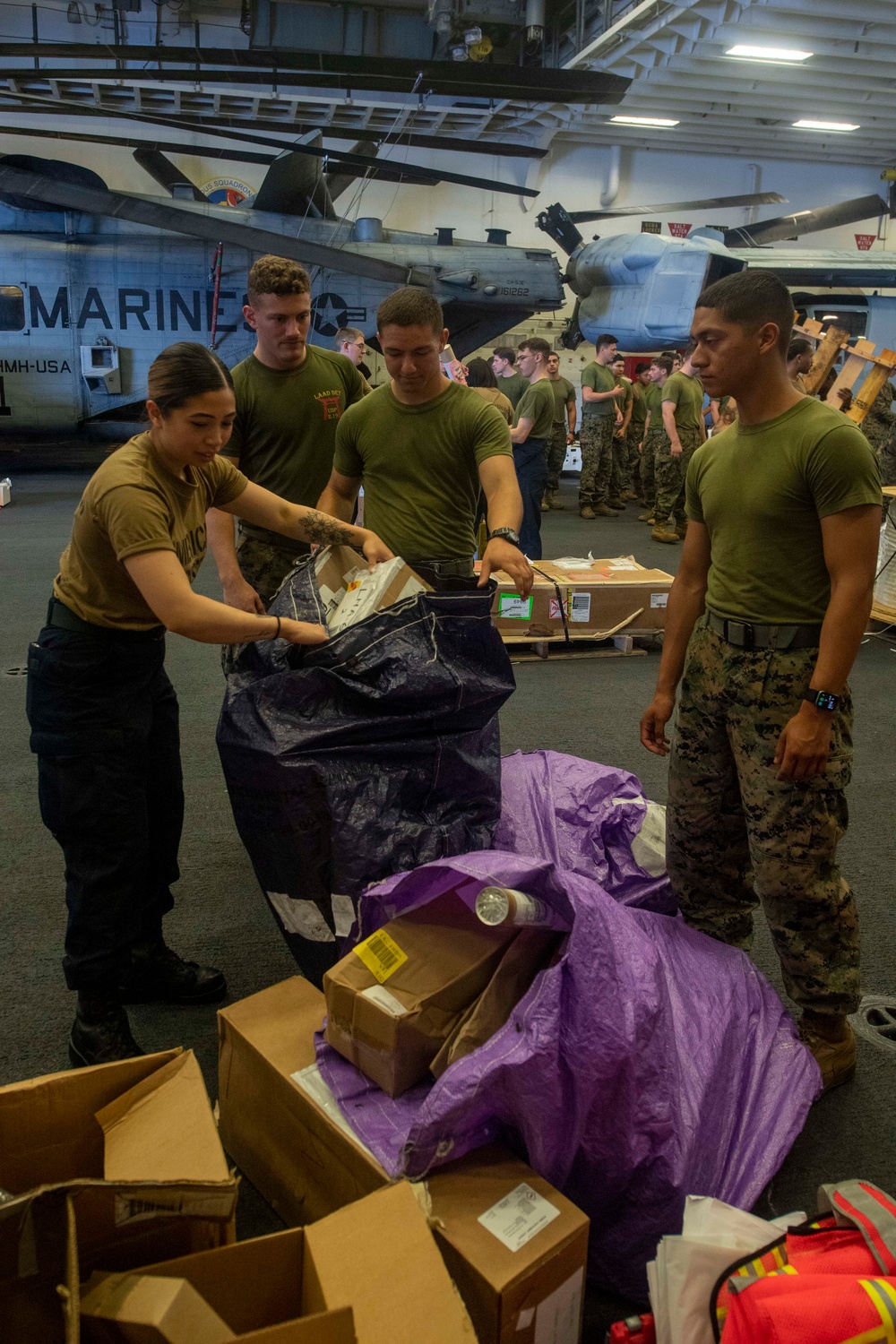 USS America conducts a replenishment-at-sea with the fleet replenishment oiler USNS Rappahannock