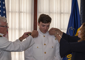Making dreams reality: young man commissions to become Navy doctor.