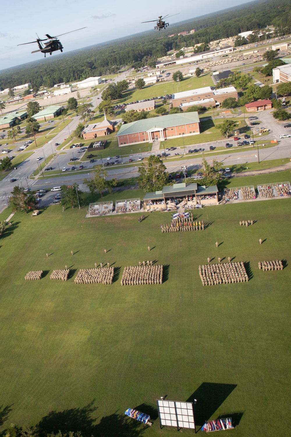 The 3rd Combat Aviation Brigade conducts a fly over at the 3rd Infantry Division change of command ceremony.