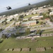 The 3rd Combat Aviation Brigade conducts a fly over at the 3rd Infantry Division change of command ceremony.