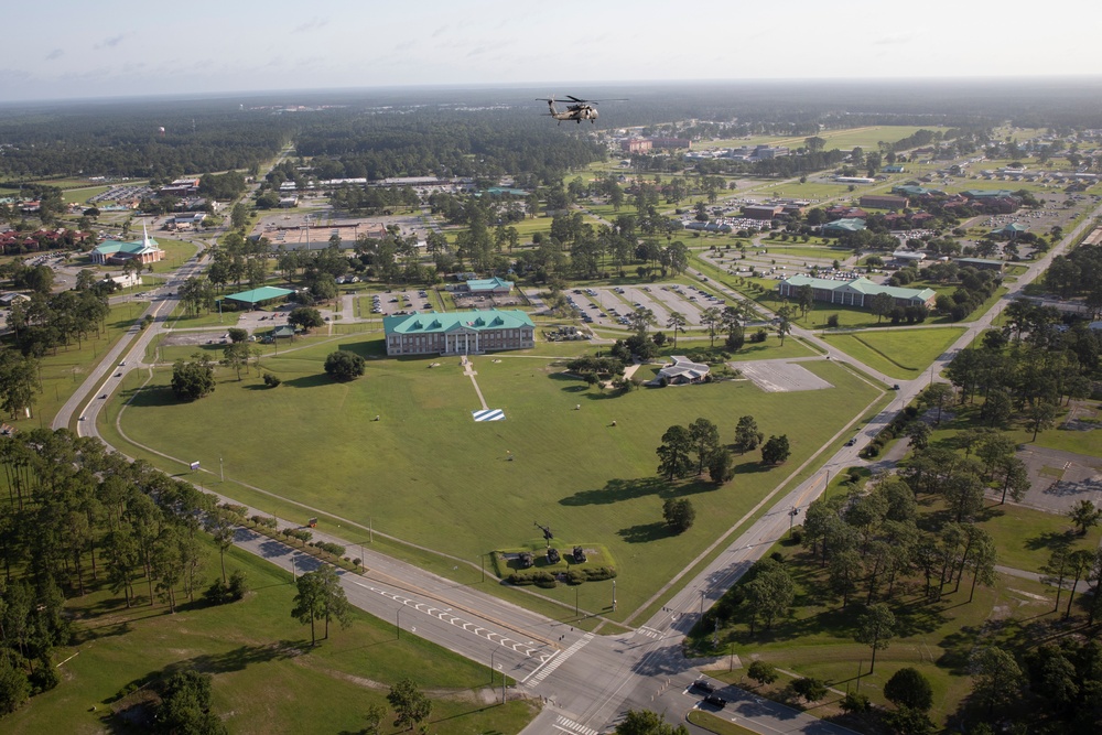 The 3rd Combat Aviation Brigade conducts a fly over at the 3rd Infantry Division change of command ceremony.