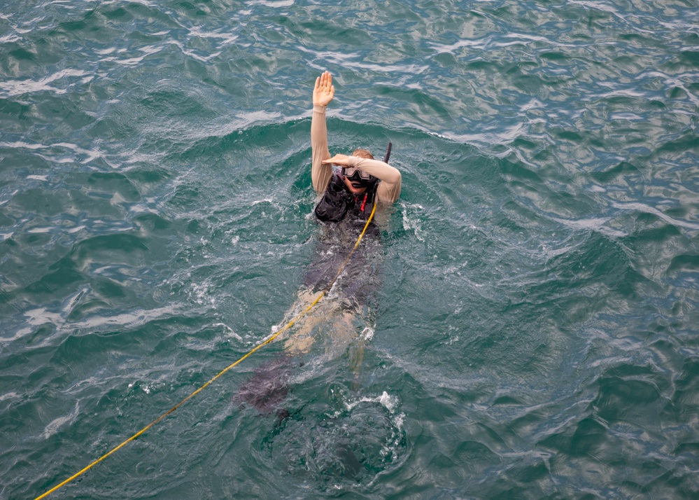 USS Sioux City Sailor Participates in a Man Overboard Drill