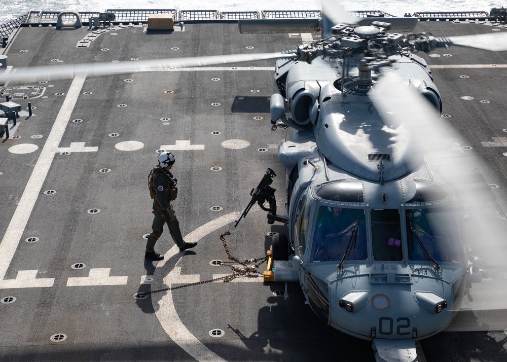 Naval Air Crewman Prepares to Embark an MH-60S Seahawk Helicopter