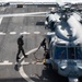 Naval Air Crewman Prepares to Embark an MH-60S Seahawk Helicopter