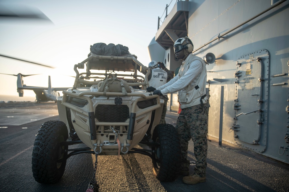 11th MEU Reconnaissance Marines load UTV onto CH-53E Aircraft