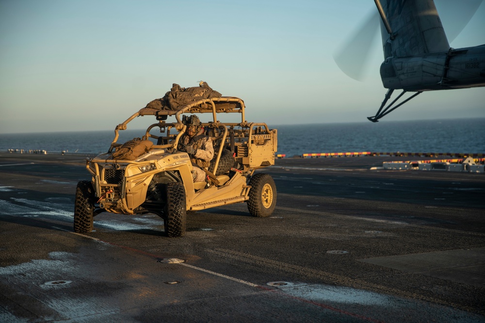 11th MEU Reconnaissance Marines load UTV onto CH-53E Aircraft