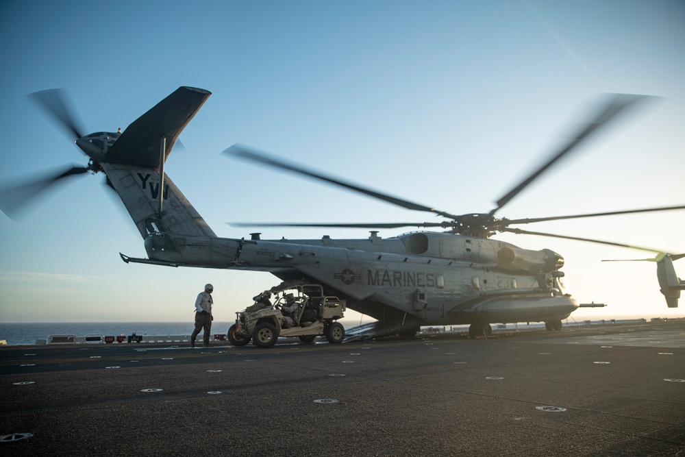 11th MEU Reconnaissance Marines load UTV onto CH-53E Aircraft