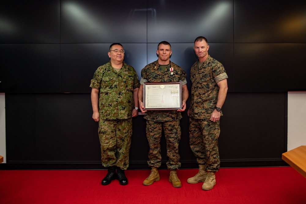 U.S. Marine awarded by JGSDF Major General Tarumi