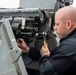 Gunner’s Mate Seaman Anthony Adino, from Queens, N.Y., conducts maintenance on a Mk38 Mod 2 25mm chain gun