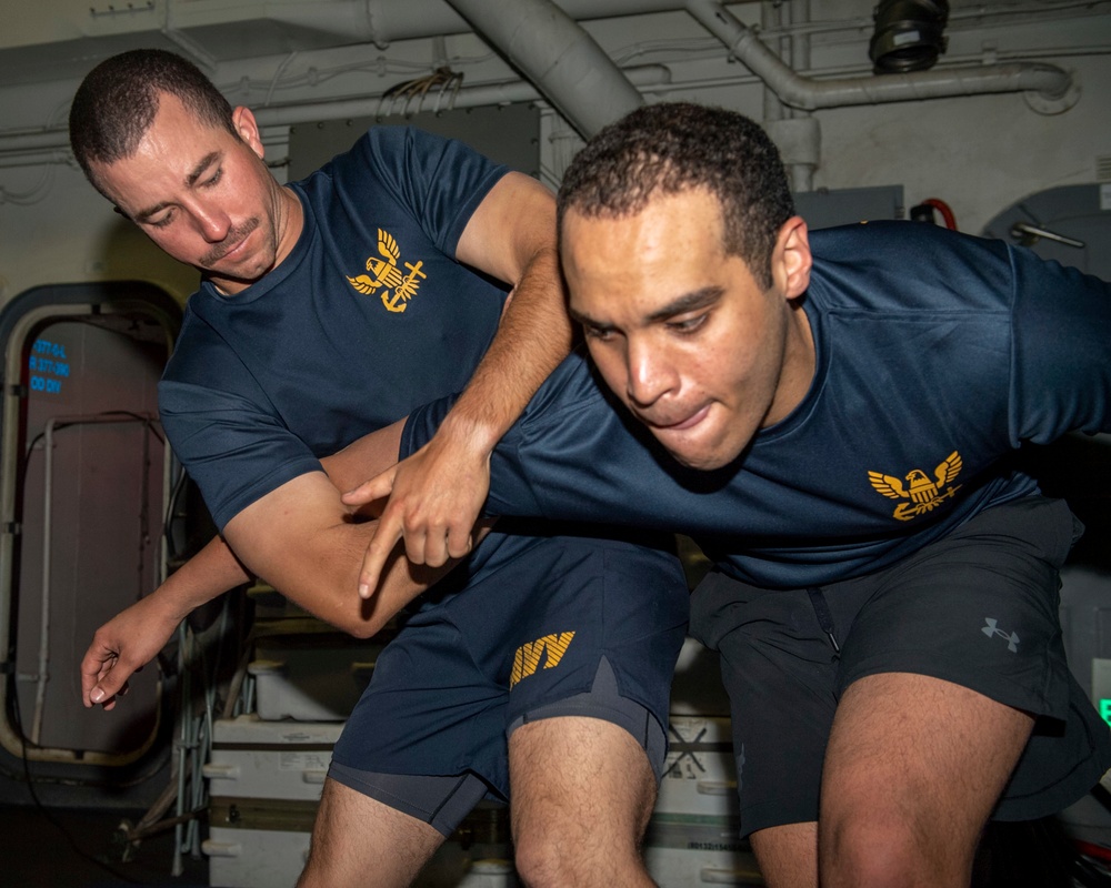 Sailors conduct sentry training aboard Arleigh Burke-class guided-missile destroyer USS Rafael Peralta (DDG 115)