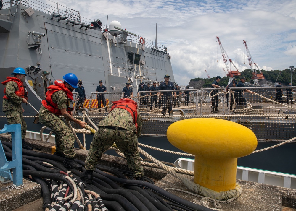 Sailors Give Slack to a Line During Sea and Anchor Evolution