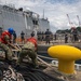 Sailors Give Slack to a Line During Sea and Anchor Evolution