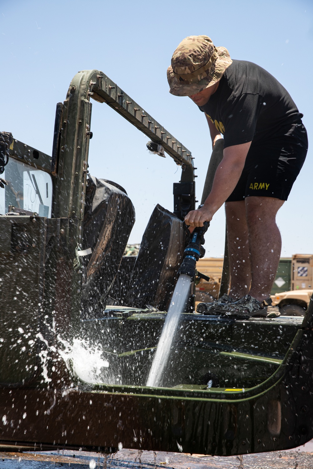 U.S. Army Soldiers Clean Vehicles