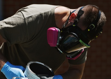 Airmen conduct maintenance on historical aircraft displays
