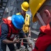 Sailors prepare line to return during a replenishment-at-sea