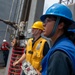 Boatswain’s Mate Seaman Kaitlyn Alfaro, from Los Angeles, Calif., operates a sliding padeye during a replenishment-at-sea