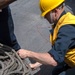 Boatswain’s Mate Seaman Graden Beasley, from San Diego, Calif., secures a pallet of line