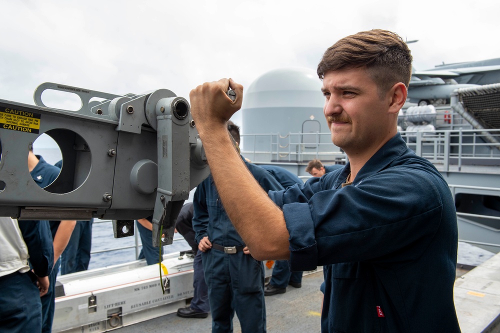 Sailors Guides Missile to NATO Launcher Aboard USS Carl Vinson (CVN 70)