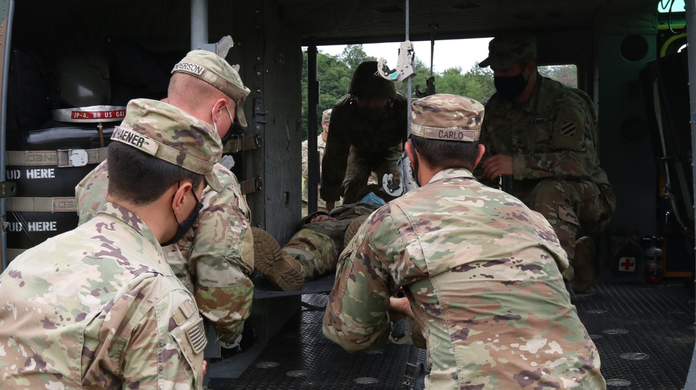 Japan Ground Self-Defense Force train U.S. Soldiers on helicopter loading procedures during Orient Shield 21-2