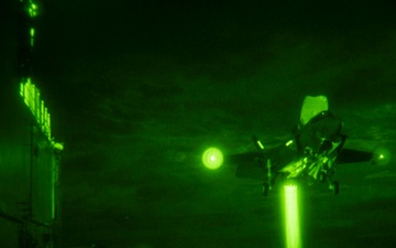 USS America (LHA 6) conducts night flight operations with the 31st Marine Expeditionary Unit