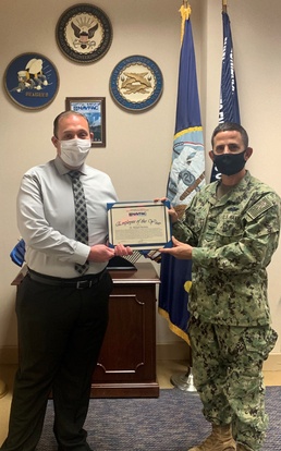 Dr. Robert Nichols, management analyst, earned Employee of the Year (Tier III) honors