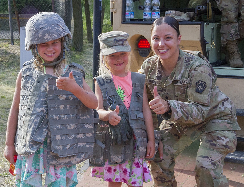Deployed guardsmen provide static display at children's event in Poland