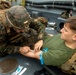 Hospital Corpsman Even James Provides Care to Marine