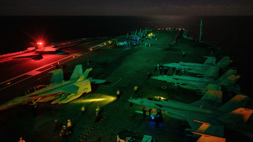 USS RONALD REAGAN conducts night flight operations in the Indian Ocean