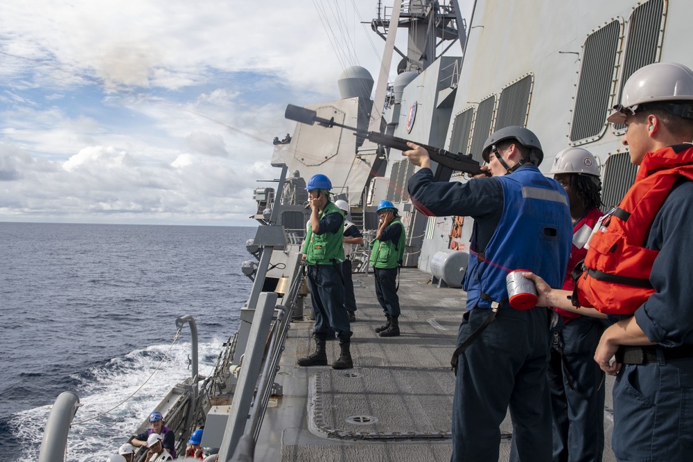 Sailors fire a shot line