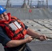 Sonar Technician (Surface) 2nd Class William Ford, from Mobile, Ala., heaves a line